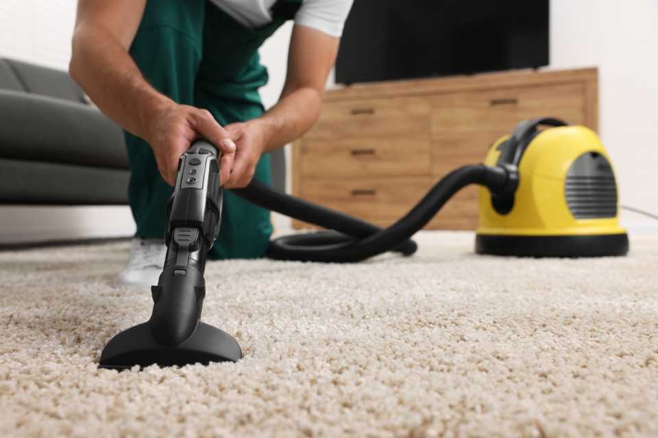 professional cleaning white carpet in modern living room